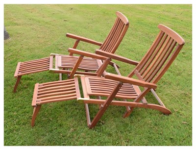 Lot 662 - Pair of teak fold-up patio sun loungers