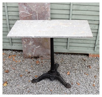 Lot 647 - Iron tripod table with two marble tops