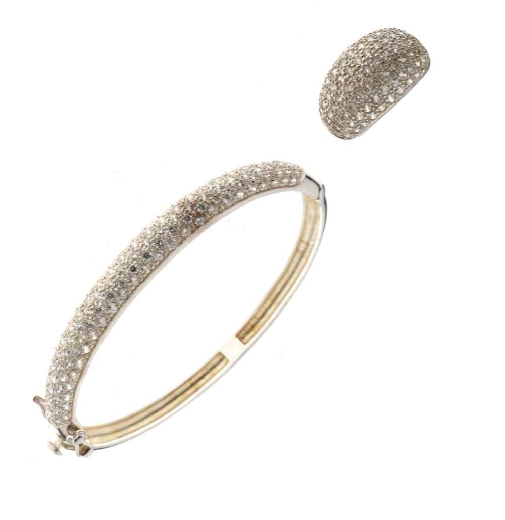 Lot 46 - Matching suite comprising  snap bangle and ring size N, both pave set with cubic zirconia