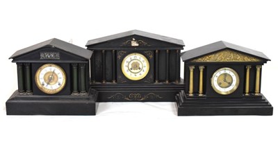 Lot 392 - Two black slate temple clocks and one metal cased temple clock