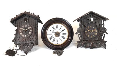 Lot 426 - Two cuckoo clocks (bits) and a postman alarm clock