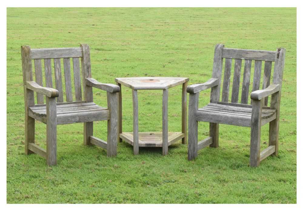 Lot 657 - Woodfurn three-piece teak garden set
