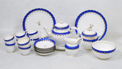 Lot 613 - Blue and gilt fluted tea set