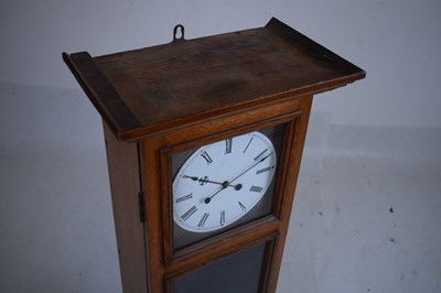 Lot 516 - Mid 20th Century oak-cased electric clock