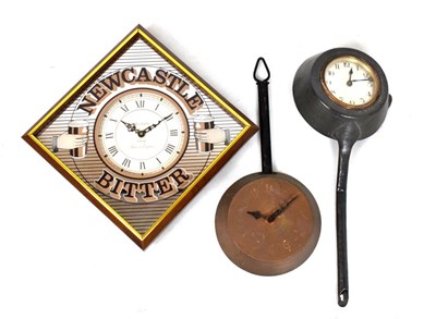 Lot 411 - Newcastle Bitter novelty wall clock and two others