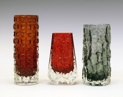 Lot 470 - Whitefriars - 1970s 'Aztec' and 'Coffin' vases in Ruby, and a small 'Bark' in pewter