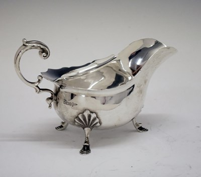 Lot 187 - Edward VII silver sauce boat with flying scroll handle