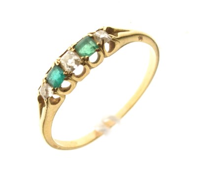 Lot 6 - Unmarked yellow metal, emerald and diamond five stone ring