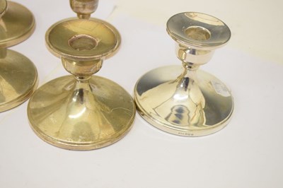 Lot 142 - Set of four George VI silver table candlesticks