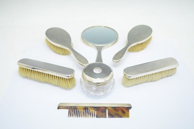 Lot 132 - George VI silver six-piece dressing table set and a George VI silver-lidded cut glass hair tidy pot