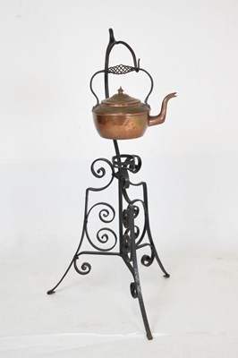 Lot 713 - Copper kettle on wrought iron stand