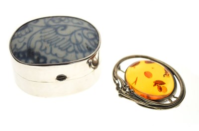Lot 43 - Amber brooch, trinket box, and two loose sapphires