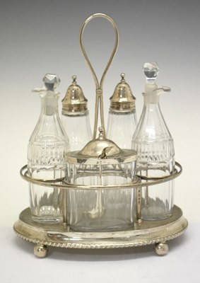 Lot 74 - George III silver cruet set the stand having loop handle and standing on four ball feet