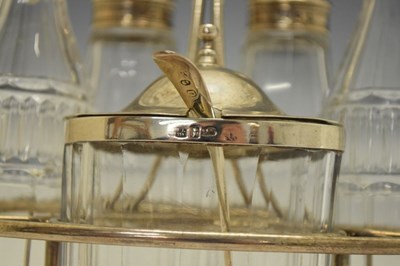 Lot 74 - George III silver cruet set the stand having loop handle and standing on four ball feet
