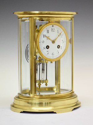 Lot 466 - Late 19th Century French lacquered brass oval four-glass mantel clock - Vincenti