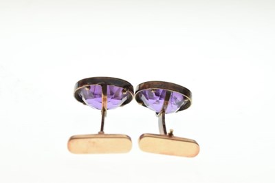 Lot 60 - Pair of gold cufflinks with amethyst coloured stones