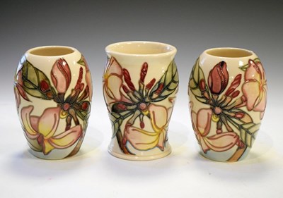 Lot 482 - Moorcroft Pottery - Three modern 'Magnolia' pattern vases