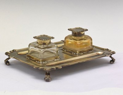 Lot 201 - George V silver shaped rectangular desk stand having two glass inkwells