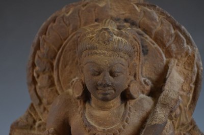 Lot 267 - Indian carved buff stone figure of Skanda / Kartikeya