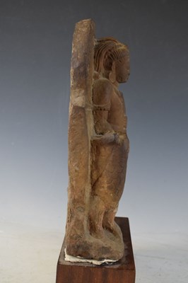 Lot 267 - Indian carved buff stone figure of Skanda / Kartikeya