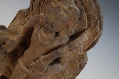 Lot 267 - Indian carved buff stone figure of Skanda / Kartikeya