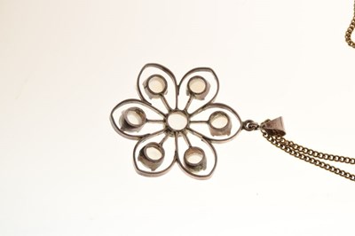 Lot 65 - White metal floral design pendant set seven moonstones, on a silver gilt chain