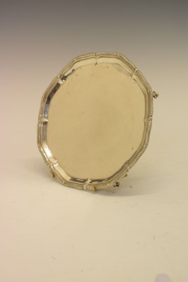 Lot 205 - George V silver salver with gadrooned piecrust edge and standing on four ball and claw feet