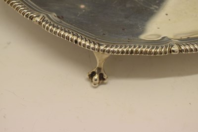 Lot 205 - George V silver salver with gadrooned piecrust edge and standing on four ball and claw feet