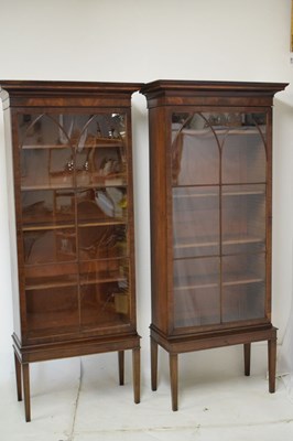 Lot 560 - Pair of early 19th Century glazed mahogany bookcase section on later stands