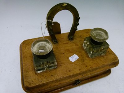 Lot 560 - Late Victorian oak desk stand with brass horseshoe design pen stand