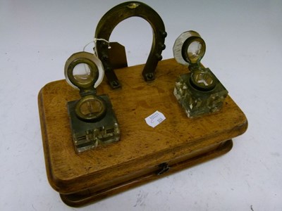 Lot 560 - Late Victorian oak desk stand with brass horseshoe design pen stand