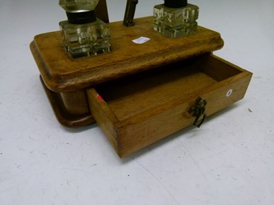 Lot 560 - Late Victorian oak desk stand with brass horseshoe design pen stand