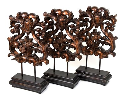 Lot 647 - Three decorative wooden baroque-style mounted sculptures