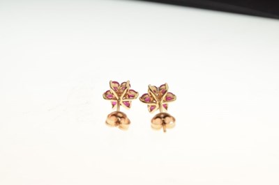 Lot 62 - Pair of unmarked diamond and ruby daisy cluster ear studs