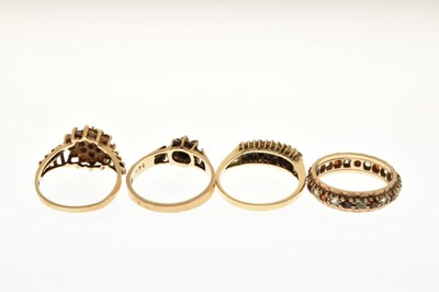 Lot 20 - Three 9ct gold garnet set dress rings a 14ct dress ring set white and blue stones