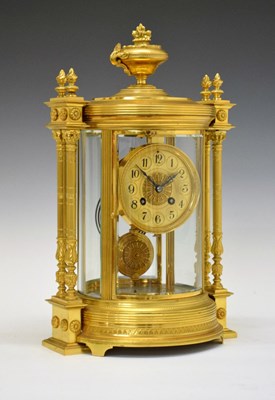 Lot 467 - Late 19th Century French gilt brass circular four-glass mantel clock