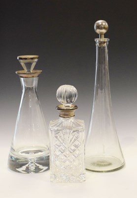 Lot 198 - Elizabeth II silver mounted decanter, two other decanters and a dressing table set