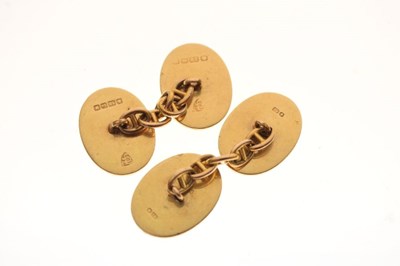 Lot 46 - Pair of 18ct gold cufflinks, engraved with hand symbol