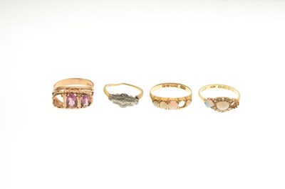Lot 38 - Four gold dress rings, all missing stones