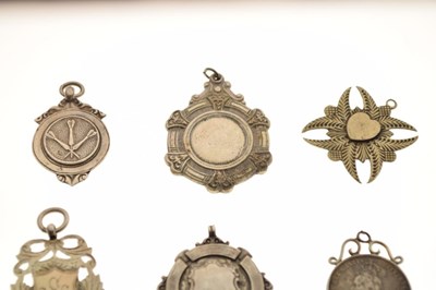 Lot 168 - Six silver and white metal fobs