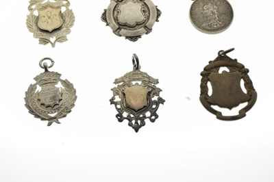 Lot 168 - Six silver and white metal fobs