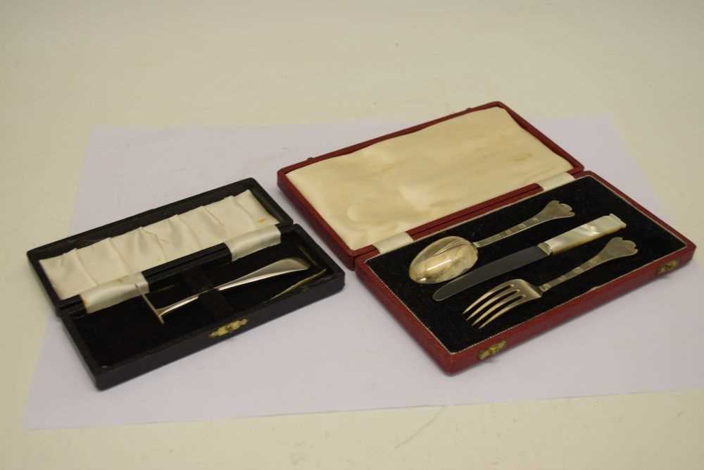 Lot 170 - Cased Elizabeth II silver three piece Christening set and a cased George V silver pusher