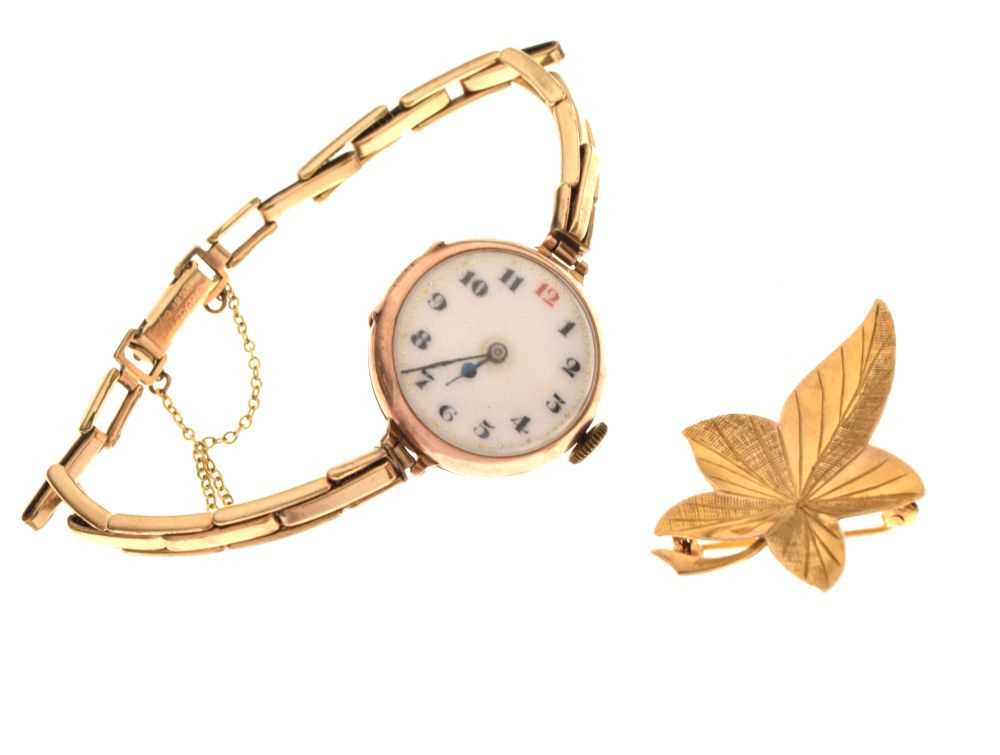 Lot 51 - 9ct gold leaf design brooch, together with a 9ct gold cased cocktail watch