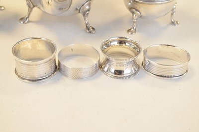 Lot 148 - Edwardian VII silver three-piece tea set and three silver napkin rings