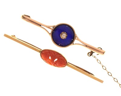 Lot 73 - Guilloche blue enamel and seed pearl decorated bar brooch, and a cinnabar bar brooch