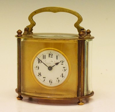 Lot 454 - Early 20th Century brass oval carriage timepiece