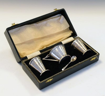 Lot 192 - Cased George VI Art Deco style three-piece silver condiment set