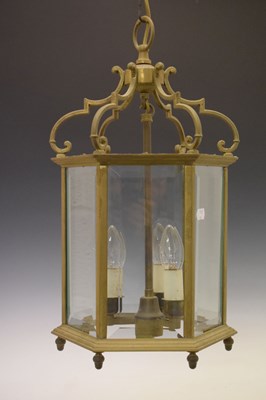 Lot 629 - Gilt metal and glazed hexagonal three-light hall lantern