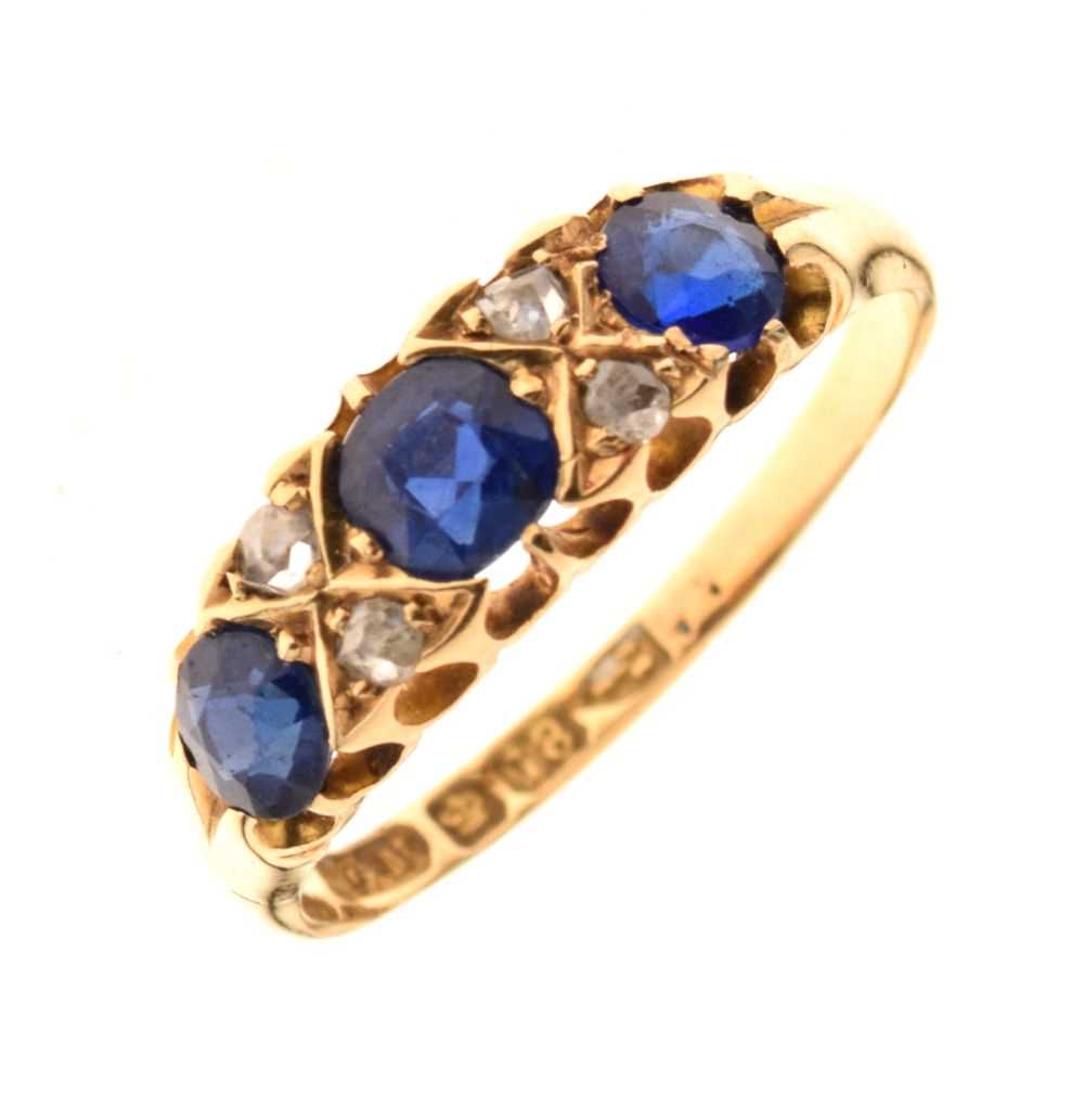 Lot 13 - Blue garnet topped doublet and diamond 18ct gold ring