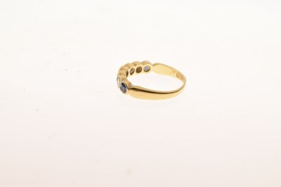 Lot 29 - 18ct gold half hoop ring, set with four sapphire and three brilliant cut diamonds